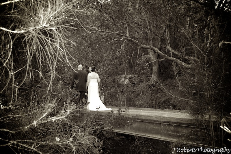 Sepia of bride and groom on bridge - wedding photography sydney